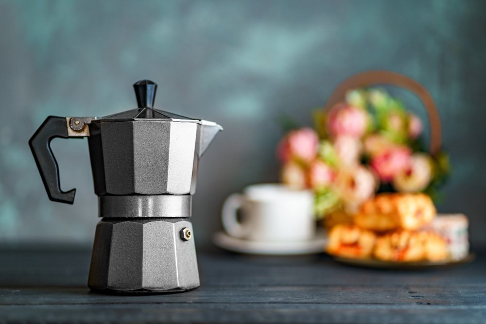 https://millilitre.my/wp-content/uploads/2021/06/mocha-coffee-maker-flowers-sweets-dark-surface-coffee-time.jpg